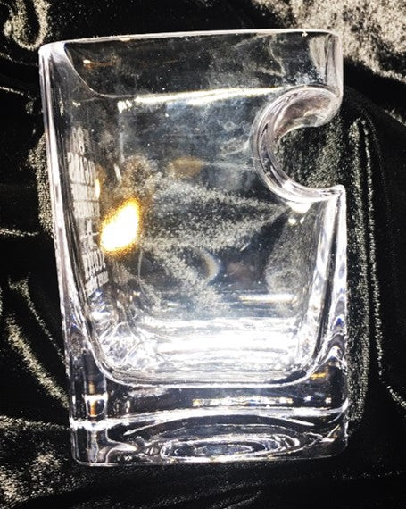 Cigar Glass - drinking glass that holds a cigar.  Side view.