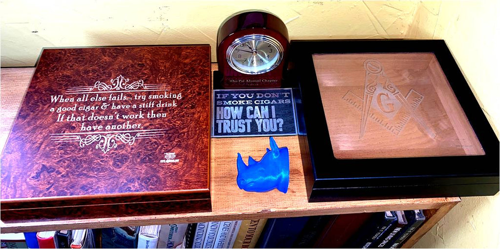 Twenty stick humidors.  Burl wood top and Ebony glass top finish.